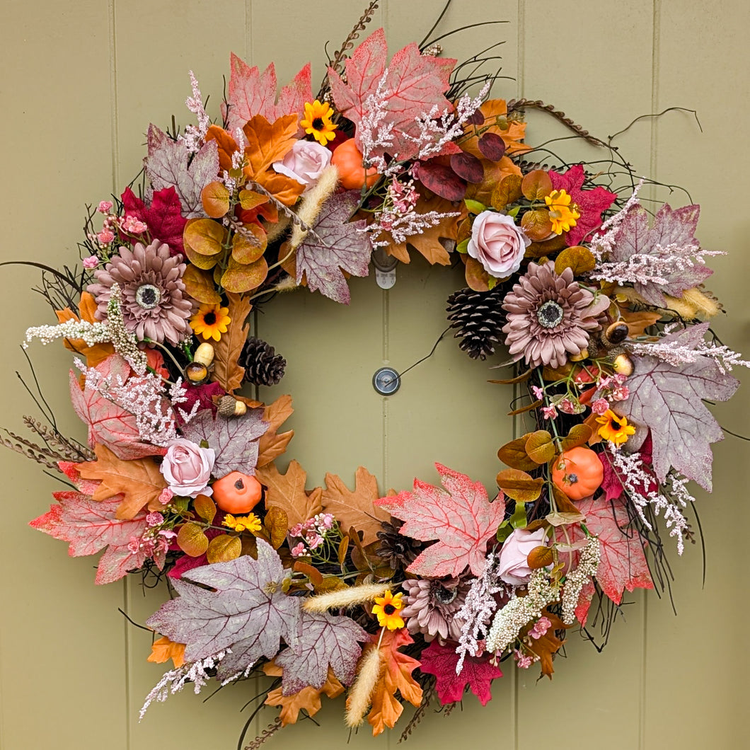 autumn artificial flower wreath made by Partridge Blooms in Glasgow, Scotland with pumpkins. 